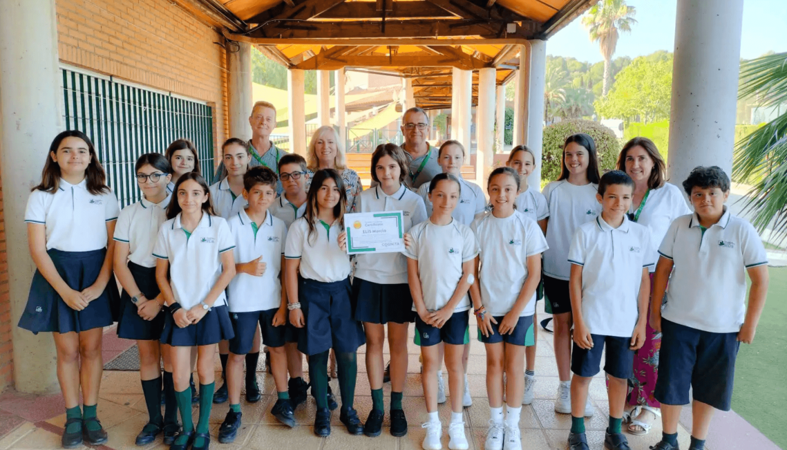 Group of students from winning school El Limonar International School in Spain, proudly stand outdoors with their winners certificate from global Student Challenge 2024